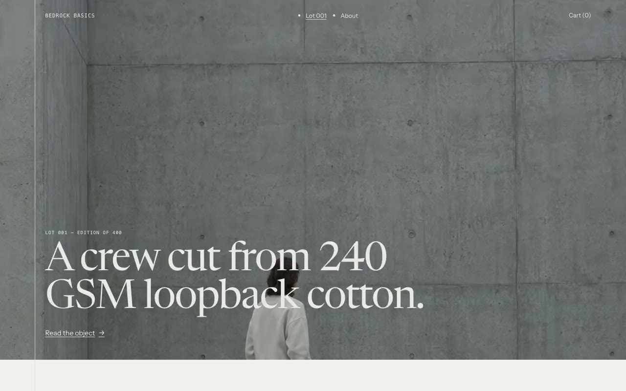 The Bedrock Basics storefront: a concrete wall, and the line &lsquo;A crew cut from 240 GSM loopback cotton.&rsquo;